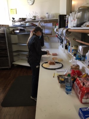 Kelly Melvin creating a meat tray